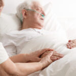 Dying senior man and his wife